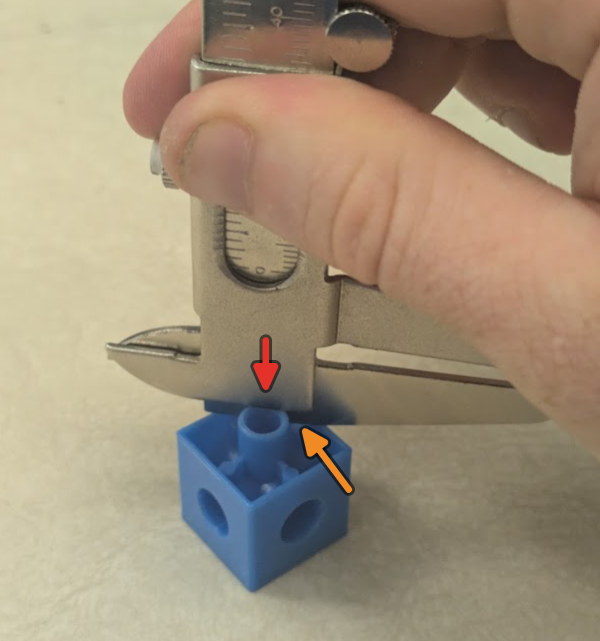Move the jaws apart first, then place the left most jaw flush along the face you are referencing from. Slide the right jaw slightly up and then push down. The thumb screw is not used.